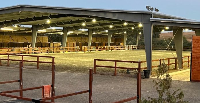 covered arena and horse stalls